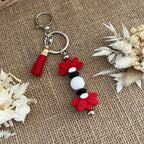 Bijou de sac fleur lotus rouge – Accessoire sac élégant et idée cadeau femme Lanyard & Co