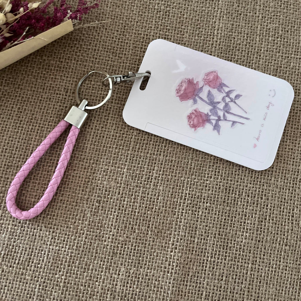 porte clef cordon tressé rose et mousqueton gris