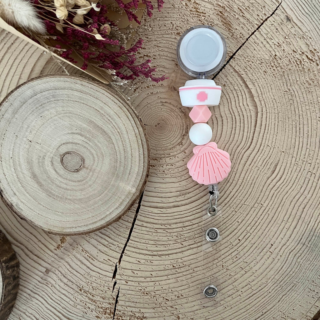 Porte-carte enrouleur infirmière rose et blanc en perles de silicone 
