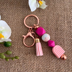 Porte-clés arc-en-ciel rose avec pompon
