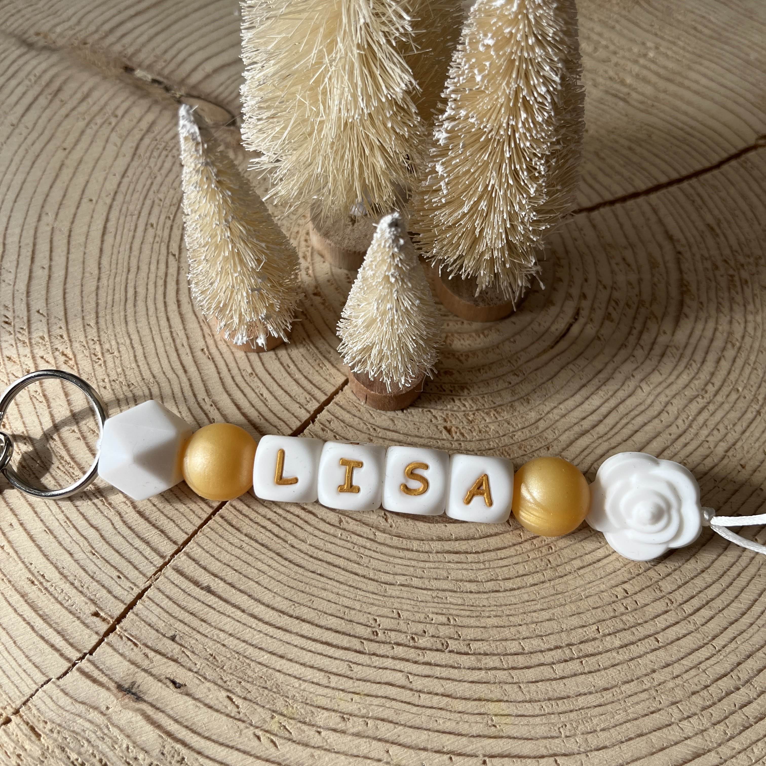 Porte-clés personnalisé en perles de silicone avec prénom jaune, blanc et fleur