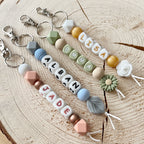 Porte-clés personnalisé en perles de silicone avec prénom, aux couleurs pastels 