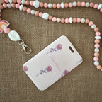 porte carte rigide coulissant, rose avec des dessins de roses seules