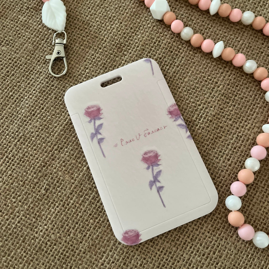 porte carte rigide coulissant, rose avec des dessins de roses seules