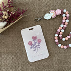 porte carte rigide coulissant, couleur rose clair avec 3 belles roses 