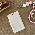 porte carte rigide coulissant, couleur rose clair avec 3 belles roses 