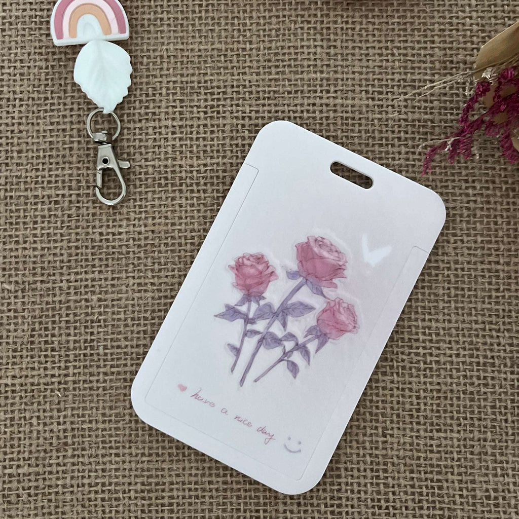 porte carte rigide coulissant, couleur rose clair avec 3 belles roses 