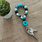 Porte-clés bracelet perlé turquoise & noir – Fleur décorative Ma boutique