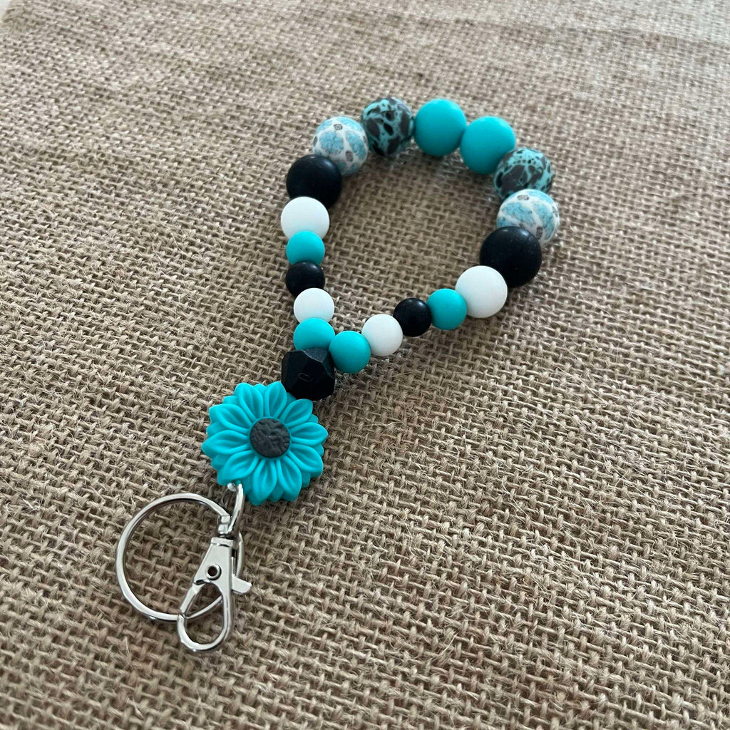 Porte-clés bracelet perlé turquoise & noir – Fleur décorative Ma boutique