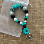 Porte-clés bracelet perlé turquoise & noir – Fleur décorative Ma boutique