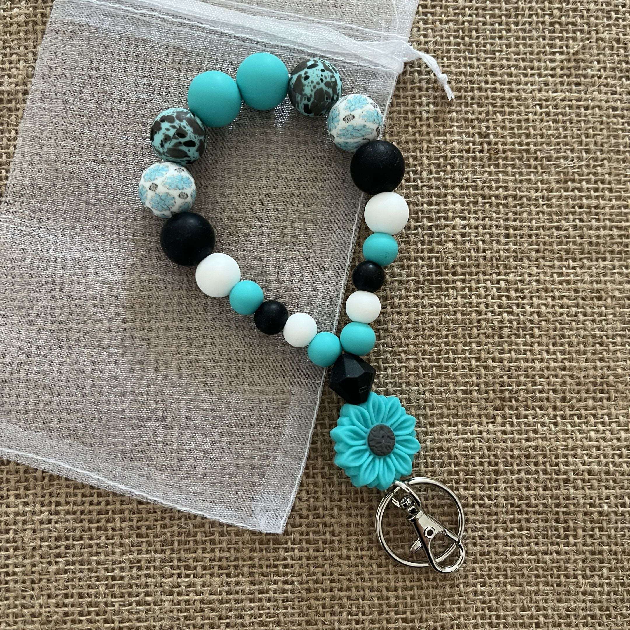 Porte-clés bracelet perlé turquoise & noir – Fleur décorative Ma boutique