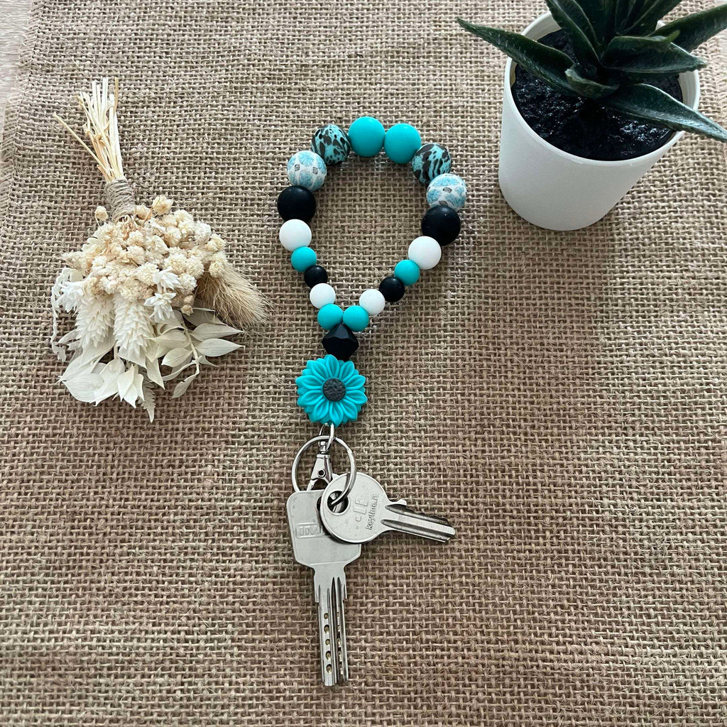 Porte-clés bracelet perlé turquoise & noir – Fleur décorative Ma boutique