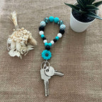 Porte-clés bracelet perlé turquoise & noir – Fleur décorative Ma boutique